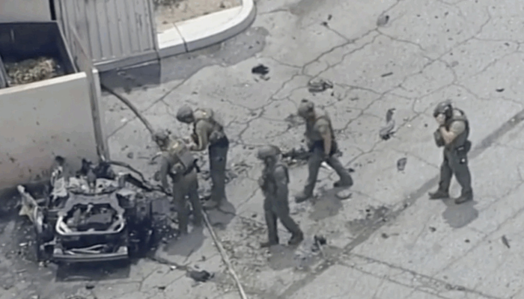 Law enforcement investigate a vehicle after an explosion on Saturday, May 17, 2025 in Palm Springs, Calif. (ABC7 Los Angeles via AP)